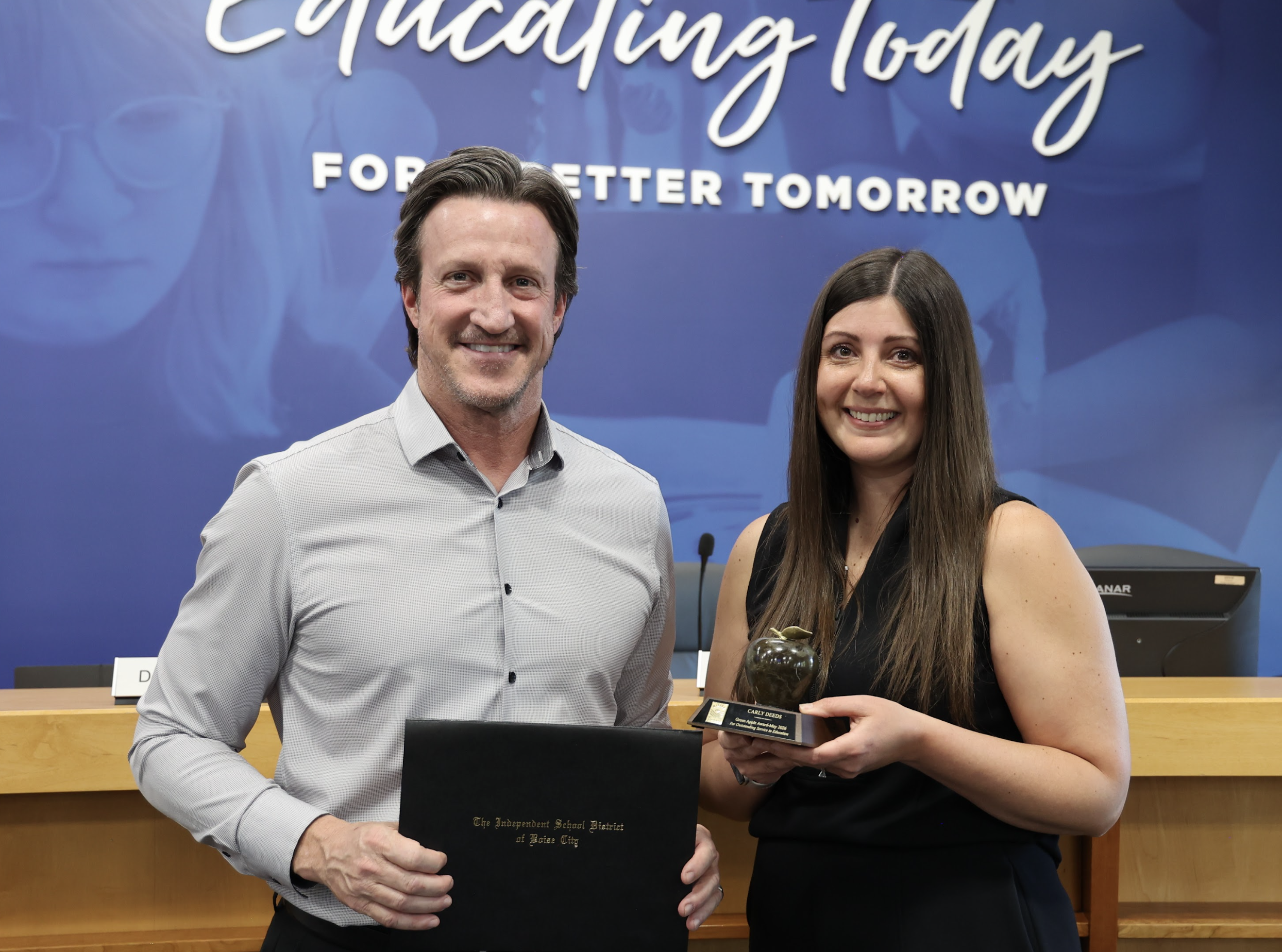 Carly Deeds receives Green Apple Award from Trustee Paul Bennion